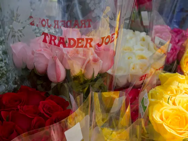 In this image I can see there are colorful roses visible in the plastic cover.