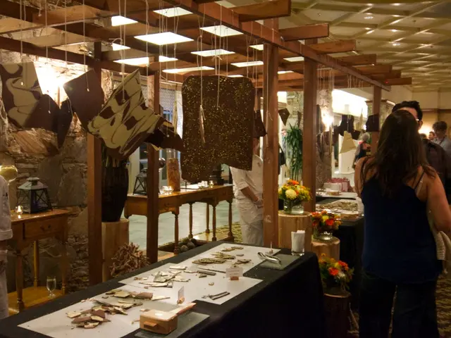 This image is taken in a restaurant. In this image there are a few people standing in front of the...