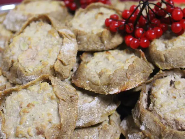 In this picture there are flour puffs and cherries in the image.