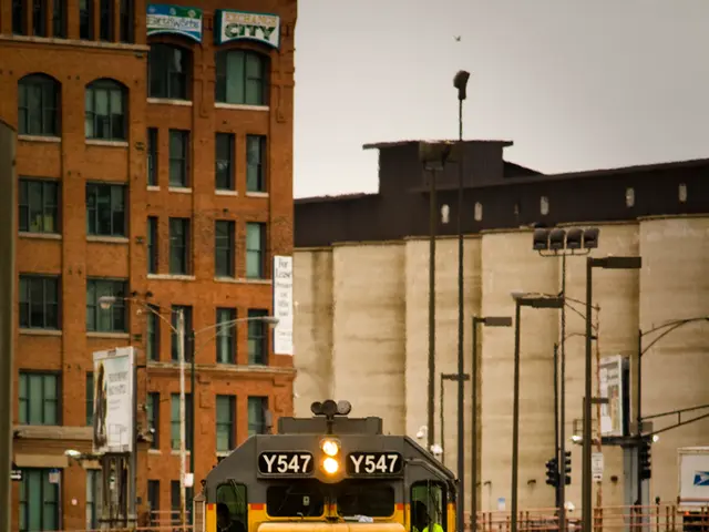 In this image there is a train on the track, beside the train there is fencing. In the background...