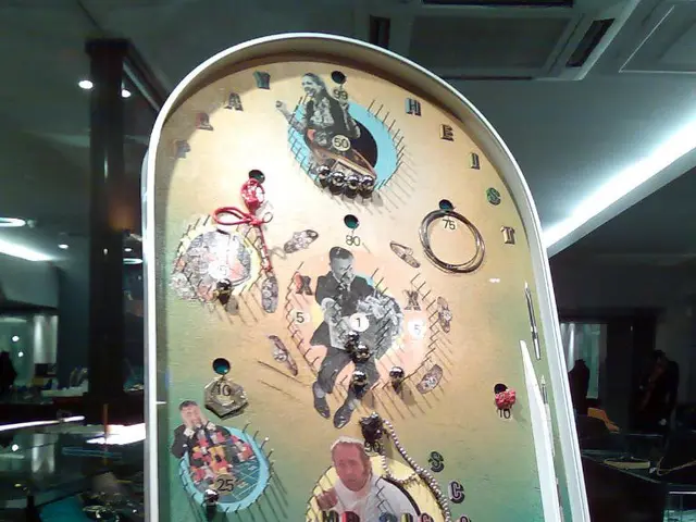 In the image i see the in front there is a pin ball game and at the back there is a ceiling and on...